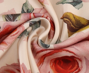 Close-up of silky satin fabric with vintage red rose floral print and smooth pearl luster