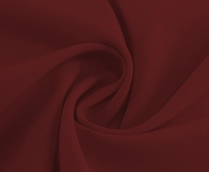 Detail shot of wine red fabric texture with elegant pleated structure and cross-weave pattern