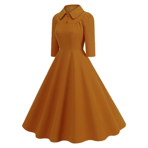 Detail of vintage amber dress showing Peter Pan collar and matching covered buttons