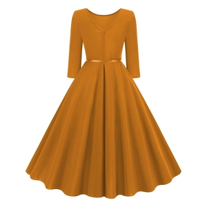 Detail view of the pumpkin orange vintage A-line dress with hidden zipper and waist belt