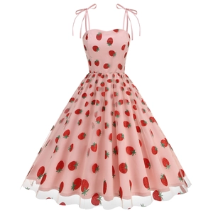 Close-up of pink tulle layers and glittery strawberry embroidery on a-line dress