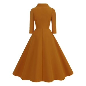 Rear view of vintage ginger yellow A-line dress with slim waist and 3/4 sleeves