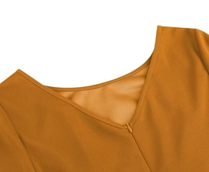 Detail view of V-neckline with invisible zipper on ginger three-quarter sleeve dress