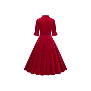 Detail of red velvet midi dress showing the flared A-line hem and ruffled cuffs