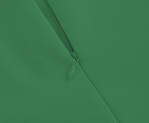 Macro view of dark green dress with seamless hidden zipper and fine woven fabric texture