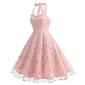 Detail of floral embroidery on pink mesh dress with elegant halter ribbon bow