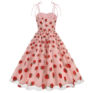 Close-up of pink tulle dress with 3D strawberry embroidery and red sequins
