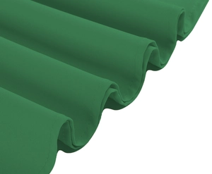 Detailed close-up of dark green pleated dress hem showing high-quality stitching and texture