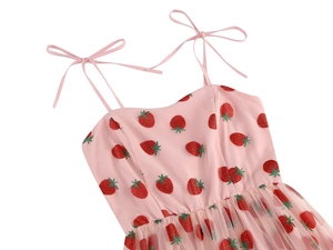 Detail of adjustable bow shoulder straps and sparkly strawberry embroidery on pink mesh dress