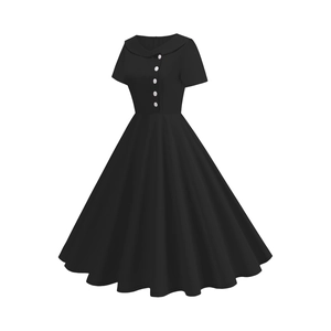 Detail of vintage black dress featuring a Peter Pan collar and white buttons decoration