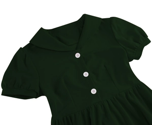 Detail of dark green vintage dress featuring white buttons and a Peter Pan collar
