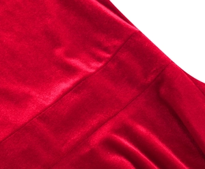 Close-up of elegant red satin fabric texture showing smooth glossy finish and premium weave