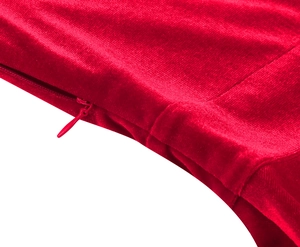 Close-up of red velvet fabric with high-quality invisible zipper and neat stitching details