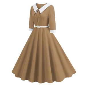Detail showing contrast Peter Pan collar and bow tie on a retro khaki midi dress