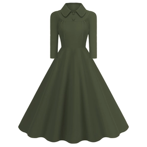 Detailed view of the dark green Peter Pan collar and button accents on the dress