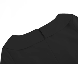 Detail of elegant black dress showing neckline stitching and rear zipper closure