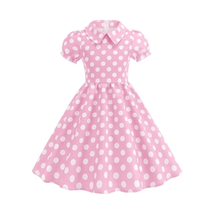Detail of pink girls' polka dot dress with Peter Pan collar and puff sleeves