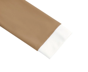 Detailed macro view of the elegant brown dress featuring contrasting white cuffs and stitching
