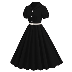 Detail of vintage 1950s black A-line dress with white buttons and pleated skirt