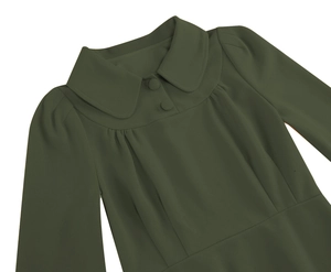 Detail of dark green dress showing Peter Pan collar with pleated texture and buttons