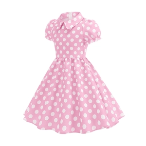 Detailed view of girls pink polka dot dress featuring a classic Peter Pan collar and puff sleeves
