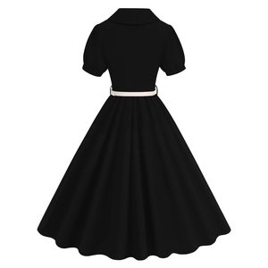 Back view of a vintage black A-line dress featuring short puff sleeves and a white waist belt
