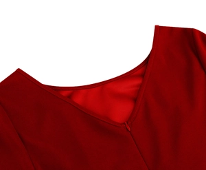 Close-up of red dress back showing V-neckline and concealed zipper with neat stitching