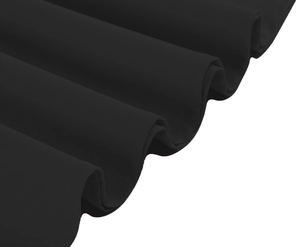 Close-up of the vintage black dress hem showing elegant pleated fabric and fine texture
