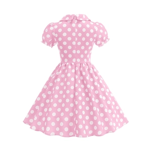 Detailed view of kids vintage pink polka dot dress with classic collar and flared hem