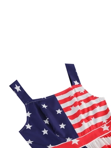 Detail of US flag print dress featuring wide straps and vibrant star and stripe patterns
