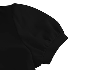 Detailed view of black retro dress with puffed sleeve design and textured fabric