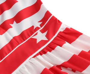 Detailed close-up of Independence Day dress featuring red white stripes and stars patterns