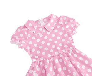 Detail of pink polka dot cotton girls' dress featuring a classic Peter Pan collar