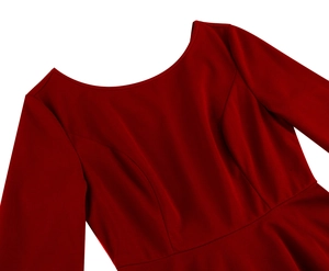 Detail of red dress bodice showing the round neckline and precise tailoring on the bust