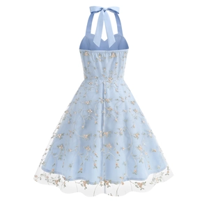 Detail of light blue mesh dress featuring floral embroidery and elegant back halter bow