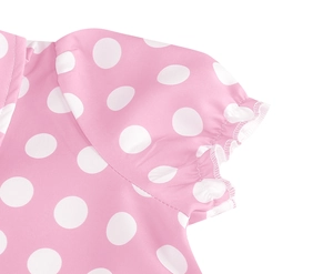 Detail of pink polka dot dress showing the collar and puffed sleeve stitching