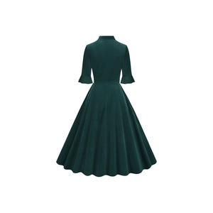Rear view of dark green velvet vintage dress with elegant bell sleeves and flared hem