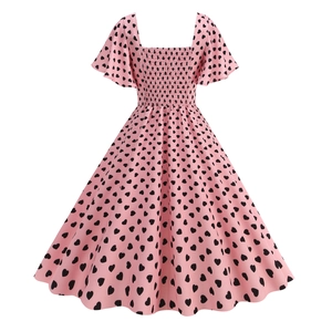 Detail of square neckline and smocked bodice on pink heart print vintage dress