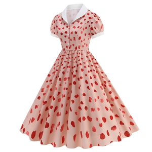 Detailed view of pink A-line vintage dress with red heart prints and white lapel collar