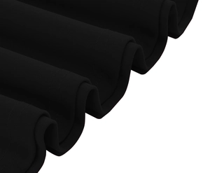 Detailed view of black dress hem showing wavy pleated layers and reinforced stitching