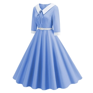 Detail of elegant light blue vintage dress with white Peter Pan collar and bow tie