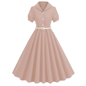 Detailed view of puff sleeves and white belt on a retro pink pleated dress