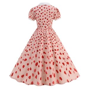 Detail of retro pink dress back view featuring red heart prints and invisible zipper closure