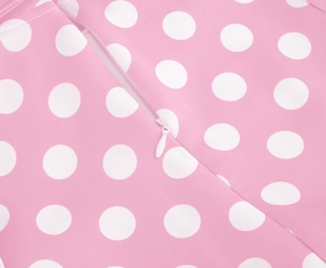 Detail of hidden zipper and white polka dot pattern on pink cotton dress fabric