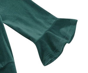 Detailed macro view of dark green velvet fabric texture and ruffled bell sleeve stitching