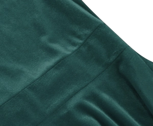 Macro detail of elegant dark green velvet fabric with precise stitching and soft texture