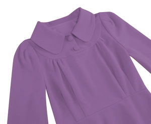 Detail of purple dress with Peter Pan collar and matching covered buttons in macro view