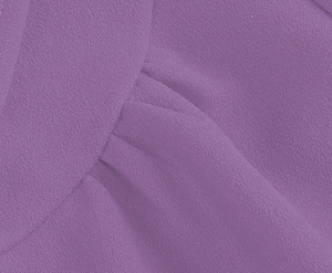 Detail shot of lavender chiffon fabric with fine grain texture and elegant pleats