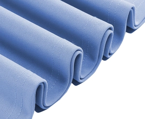 Detailed macro view of light blue fabric texture with precise double stitching on the hem