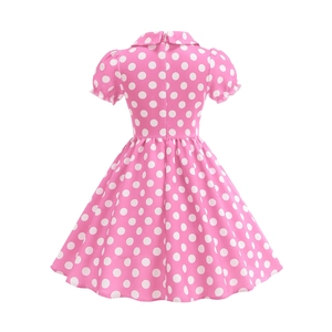 Detail view of the back of a pink polka dot cotton dress with puff sleeves and invisible zipper